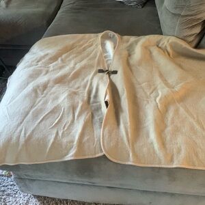 Calvin Klein Classy shawl will pair well with a white tee and jeans